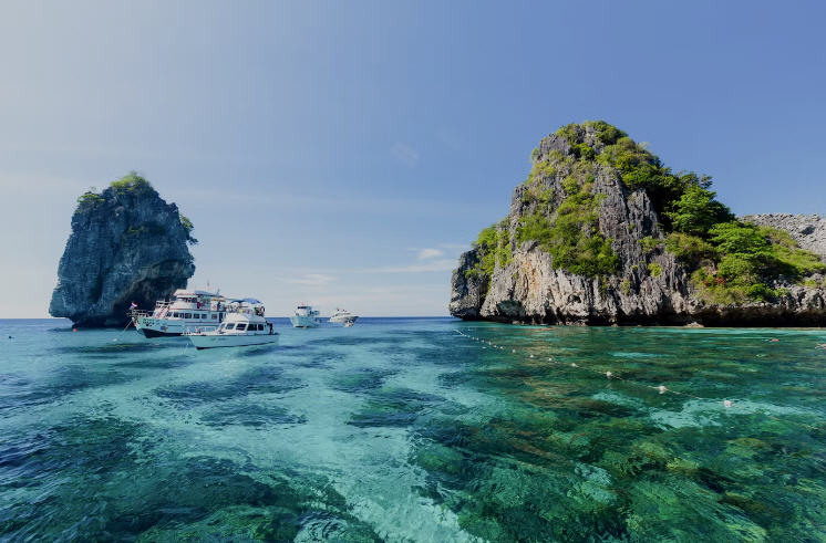 Sweeping view of Koh Lanta, Thailand, featuring long sandy beaches, lush jungle, and turquoise waters.
